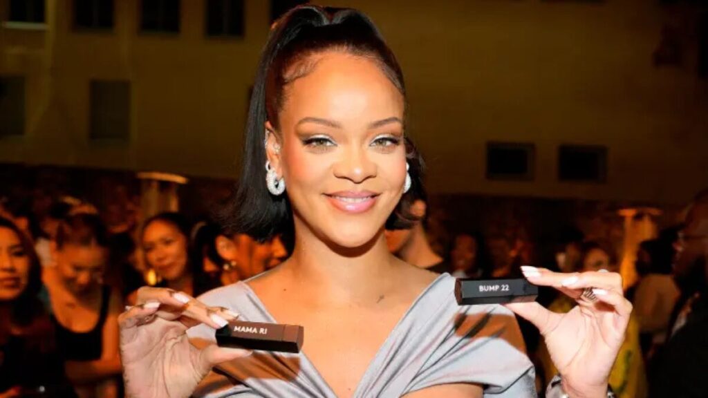 Close-up of Rihanna using Fenty Skin products, promoting her skincare brand’s routine.