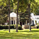 Taylor Swift's real estate empire showcasing her luxurious homes, including her Tribeca townhouse, Beverly Hills estate, and Watch Hill mansion, reflecting her strategic property investments and personal brand.