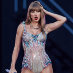 Taylor Swift a Billionaire – pop star on stage during The Eras Tour, symbolizing her record-breaking wealth and music empire